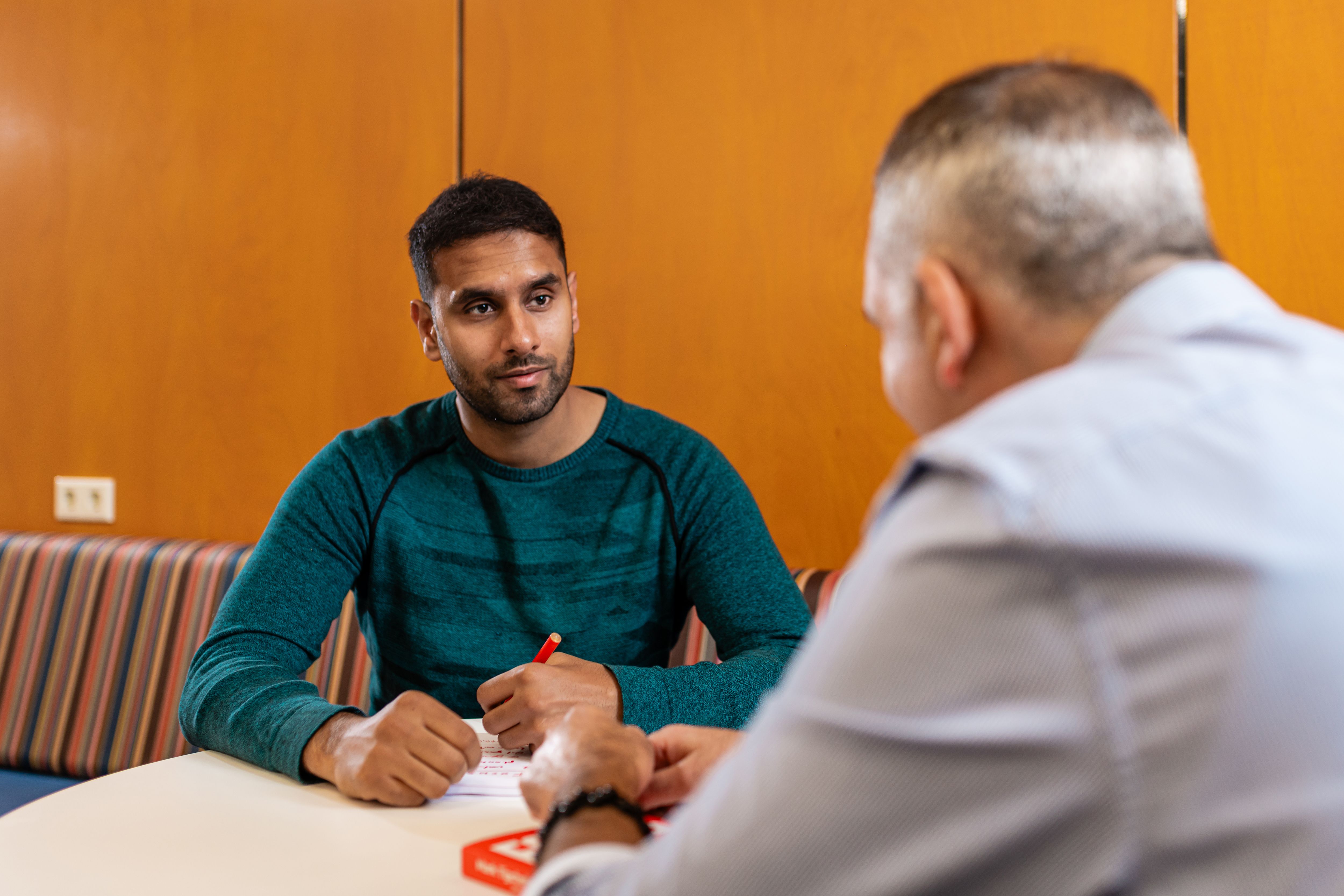 Two male students having a meeting at The Hague Univeristy of Applied Sciences